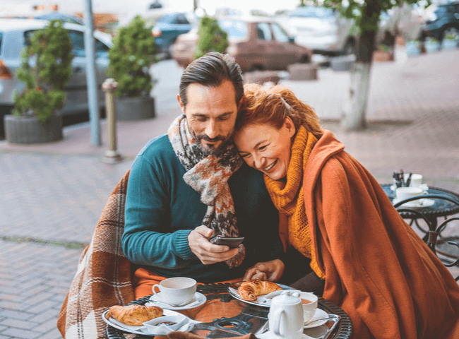Mature loving couple drinking tea outdoors